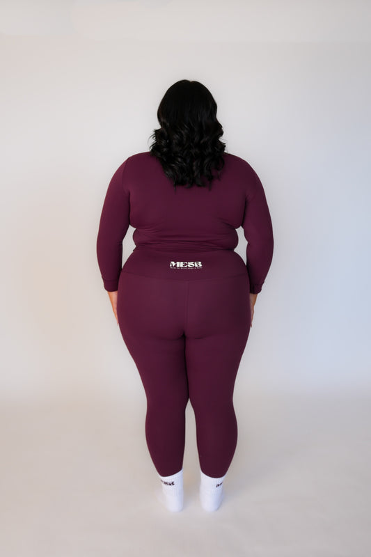 Back of a model wearing the long sleeve Garnet glow MESB set