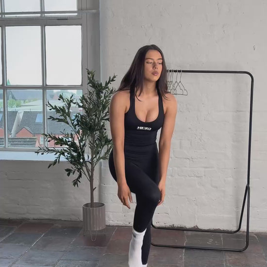 Video of model putting on shoes and jacket whilst wearing the MESB Obsidian obsession tank top set